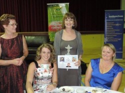 Jacqueline Freney and mother Joanne sitting in front of enthusiastic guests